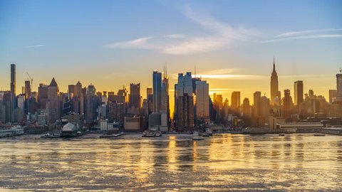 Midtown Manhattan skyline at sunrise in New York, timelapse of rising sun