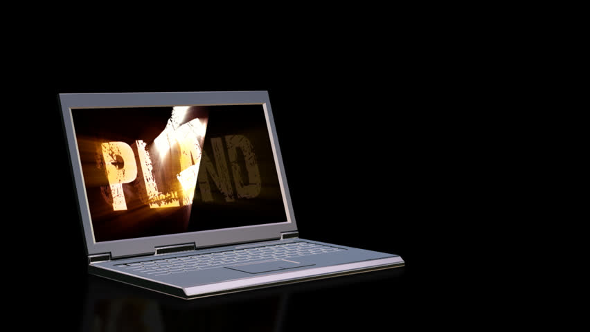 Laptop with animated musical text on the screen and light beams