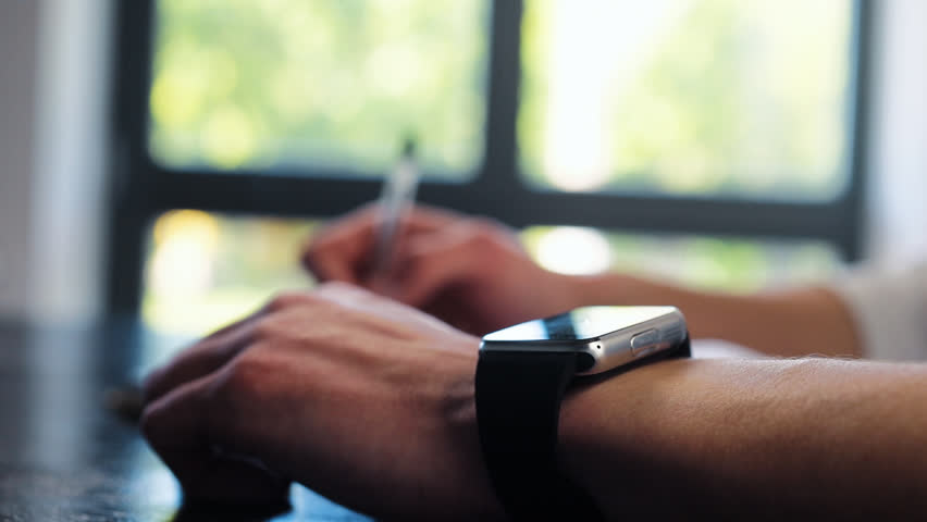 Close up of businessman hands checking incoming notification on smart watch. Animation of hologram envelope message, mail, letter, futuristic email. Future digital technology concept. | Shutterstock HD Video #1011974669