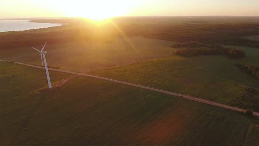 Aerial View. Beautiful windmill turbines , wind energy turbines . Aerial drone shot. | Shutterstock HD Video #1011987371