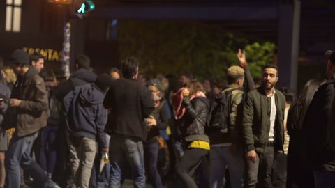 GERMANY - CIRCA MAY 2017 - People dance in street, labor day celebration party, nighttime, Berlin, Germany