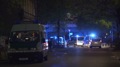 GERMANY - CIRCA MAY 2017 - Many police cars leave crime scene back to station, nighttime, Berlin, Germany