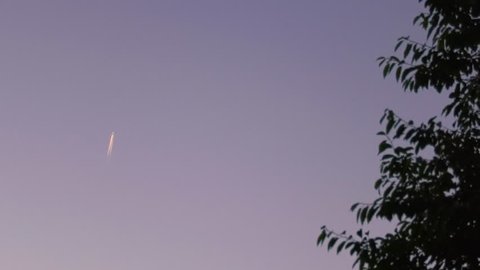 Sky at blue hour with a plane trail