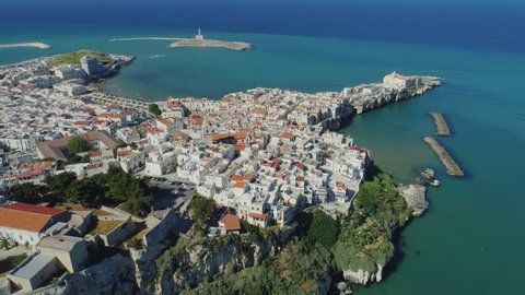 Polignano a Mare Apulia City Sea Coastline white houses ana castle in Italy Drone flight
