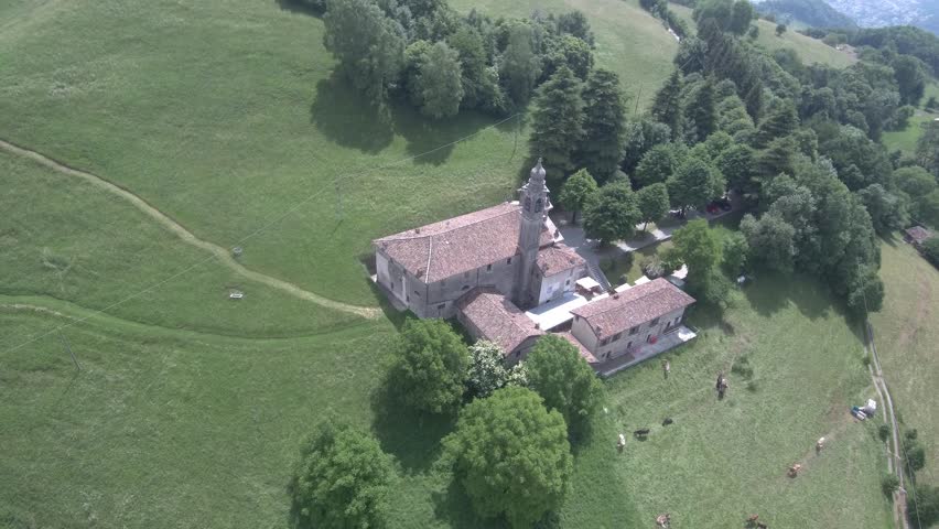 aerial drone view a church in italian Alps. church called "Sanctuary of Madonna d