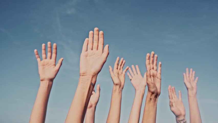 People rasing hands on blue sky background. Voting, democracy or volunteering concept | Shutterstock HD Video #1012015787