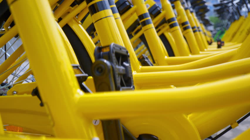 day time zhuhai city bicycle rent station slow motion close up view 4k china