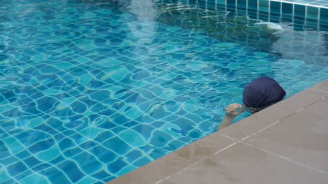 Female swimmer at the swimming pool.