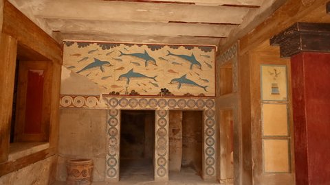 Close-up shot of a room painted with frescoes in the Minoan Palace of Knossos, Heraklion, Crete, Greece. Knossos is the largest Bronze Age archaeological site in Crete.