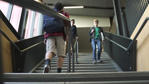 Wide shot of students descending on stairs