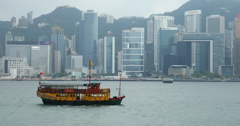 HONG KONG, JUNE 04, 2018: Traditional wooden sailboat sailing in Victoria Harbor, Hong Kong.