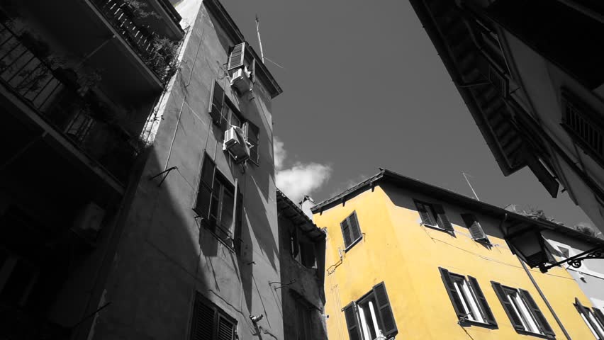 Facades of buildings in the sun seen from below