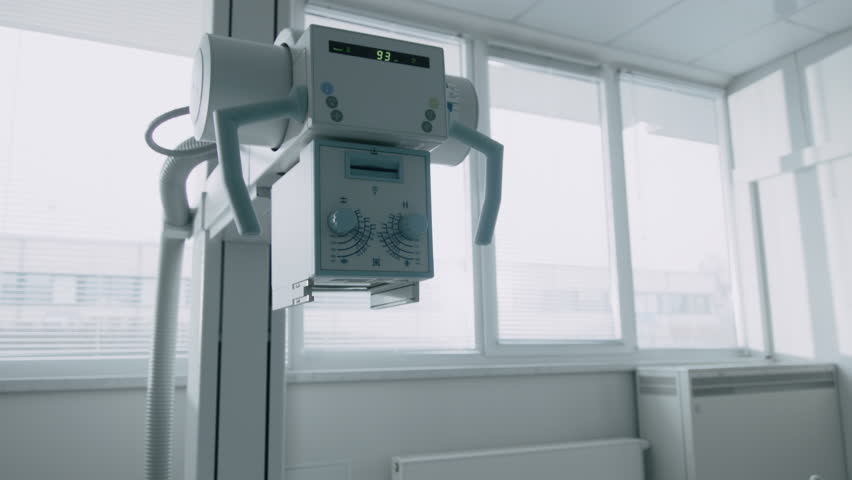 In the Hospital, Female Technician adjusts X-Ray Scanner / Machine. Modern Hospital with Technologically Advanced Medical Equipment and Professional Personnel. Shot on RED EPIC-W 8K Camera. Royalty-Free Stock Footage #1012060913