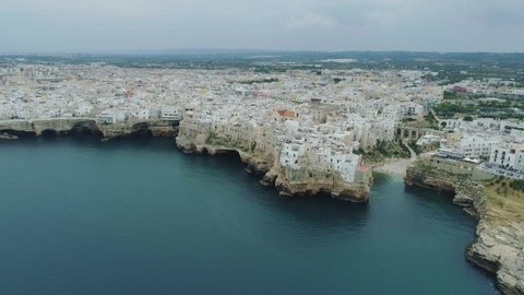City Sea Coastline and white houses Polignano a Mare Apulia in Italy Drone 4k