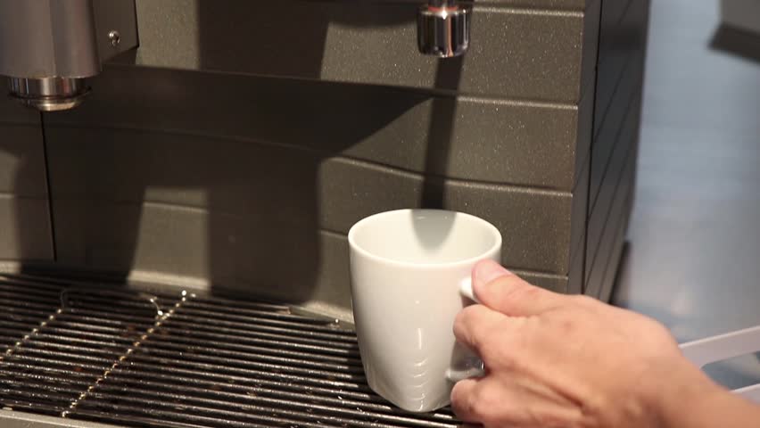Someone is pouring hot water from the automatic water dispenser. Royalty-Free Stock Footage #1012087037