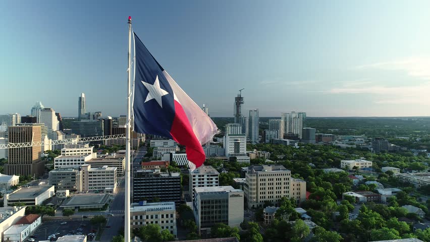 4K Aerial Orbit Texas and American Flag Austin Sunset Shutterstock HD Video...