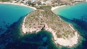 Aerial drone bird's eye view video of famous sandy beaches of Psili Amos and Agios Petros near port of Gavrio, Andros island, Cyclades, Greece