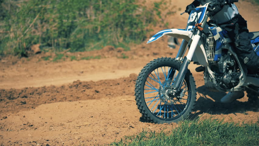 Slow motion process of a motorcyclist on his autobike 