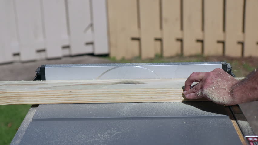 Man sawing board
