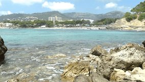 Waves at coast of Majorca island, seaside view of Paguera Peguera beach, Mediterranean Sea Spain, Balearic Islands
