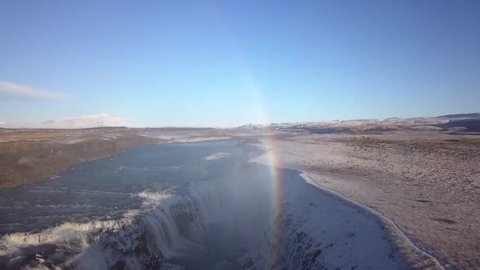 Iceland  Drone view of Gullfoss with rainbow in the background.  Golden Circle south of Iceland.  Beautiful arial view on a sunny day with flight over waterfall which shows the power and beauty
