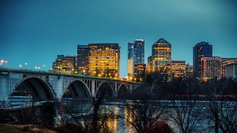 View on Key bridge and Rosslyn skyscrapers at dusk: timelapse of dat to night transition, Washington DC, USA
