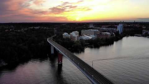 Aerial footage of the tramway bridge Alviksbron in Stockholm at sunset.