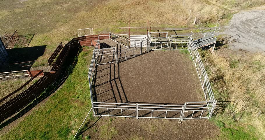 Paddock, gate and fences at the cattle farm entry on a dry land of lake George in NSW, Australia
