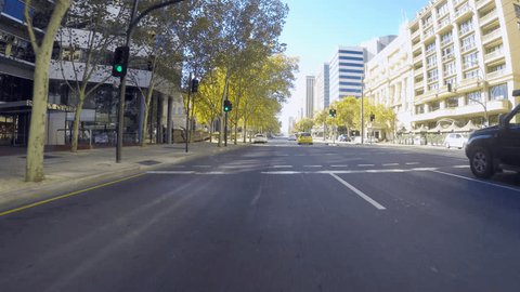 Adelaide, South Australia - April 29, 2018: Action camera vehicle POV driving along North Terrace past the Railway Station and Parliament House.