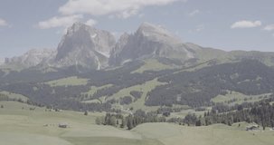 Aerial Drone Footage View of green park in Alps mountains in Italy // no video editing