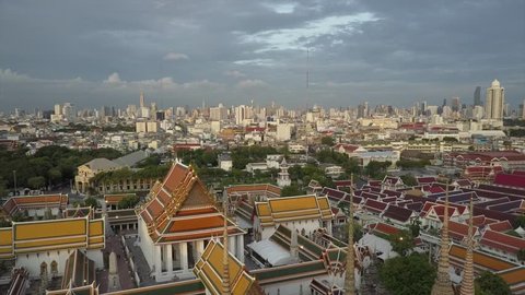 Beautiful Wat Phra Kaew temple in Bangkok Thailand drone views in 4K. Before sunset aerial views of amazing Thai Buddhist temple. Bird's eye perspective from above.