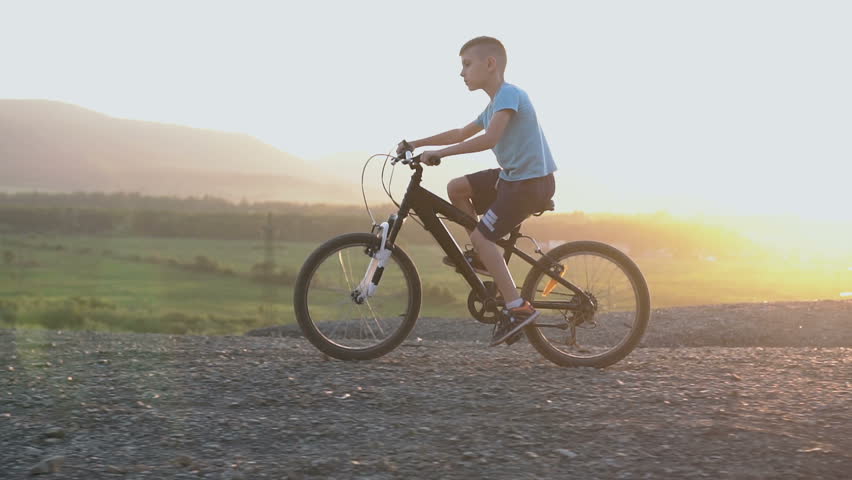 small boy riding bike