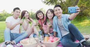 people enjoy beer and selfie happily go on a picnic