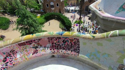 Tilt up view from bench Mosaics to Barcelona's skyline as seen from Park Guell