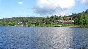 Sunny day on the lake Vanajavesi. The surroundings of the city of Hameenlinna, Finland 