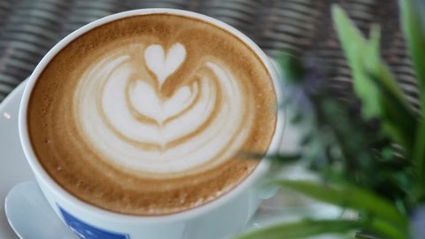 heart latte art of hot coffee drink in cup