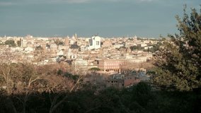Rome cityscape seen from high angle view at Gianicolo Park Janiculum Terrace viewpoint in sweeping camera pan left in Italy. 4K UHD at 29.97fps