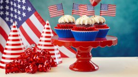Red white and blue theme cupcakes with USA flags for Independance Day or USA theme party food. - Powered by Shutterstock - Get 15% off with code: PIKWIZARD15