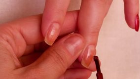 Manicure in the beauty salon. Painting and polishing nails. Spa nails cuticle scarfskin procedure. Vertical format video.