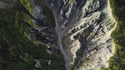 Putangirua Pinnacles, New Zealand, Aerial Top Down View, Flying Zoom Out 4k