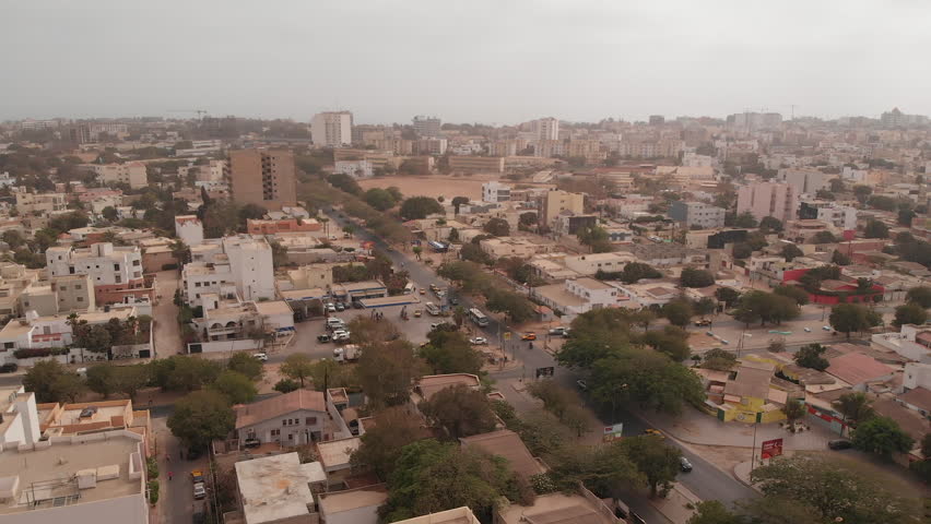 African city aerial: Dakar, Senegal. Point E district intersection of boulevard Bourguiba and Rue 9. Royalty-Free Stock Footage #1012211480