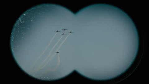 Four-one airplanes show.View through binoculars