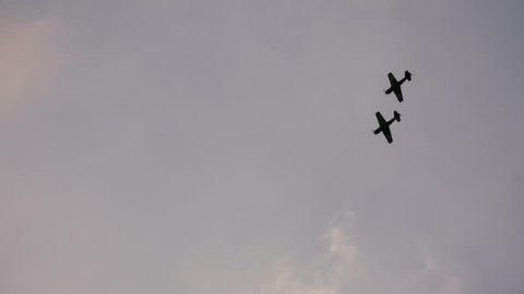 Two airplanes show.Descending