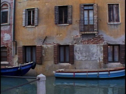 ITALY, 1999, Venice stucco house, pan right, very moody