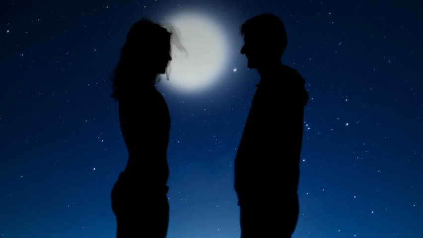 Romantic couple holding hands and kissing under starry night sky, relationships
