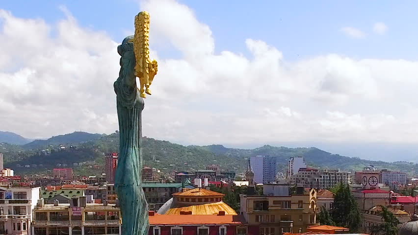 Majestic bronze sculpture of Medea with golden fleece rising over Europe square