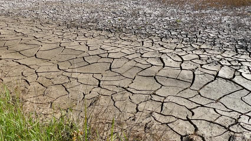 drought-stricken lands,
soil that is cracked due to drought,
 Royalty-Free Stock Footage #1012239899