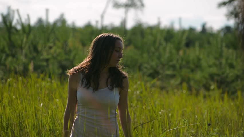 Girl dancing in the grass