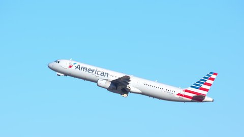 ORLANDO, FL - 2018: American Airlines Airbus A321-200 Commercial Jet Airplane Taking Off into a Blue Sky Departing from MCO McCoy International Airport on a Sunny Day in Florida