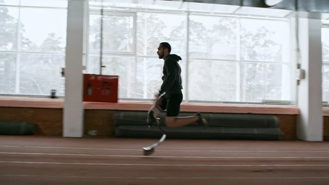 Tracking of determined adaptive runner with artificial fitness leg sprinting on indoor track
